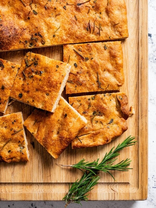 Sliced focaccia on a cutting board.