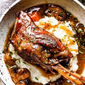 Lamb shanks served over mashed potatoes