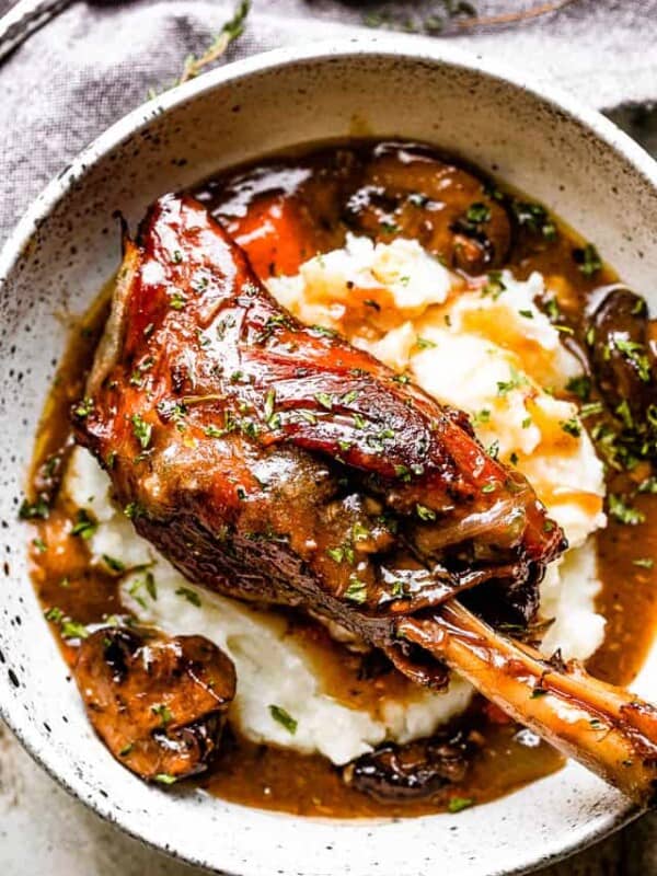 Lamb shanks served over mashed potatoes