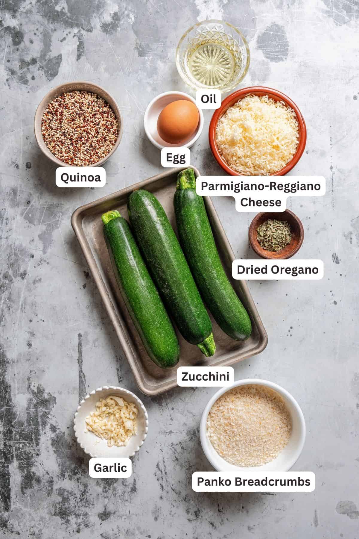 Ingredients for zucchini fritters with text labels overlaying each ingredient.